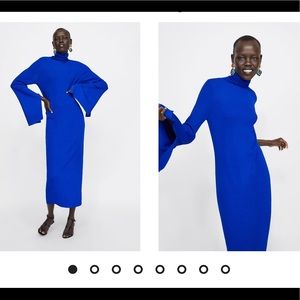 Knit high neck dress with a slit .